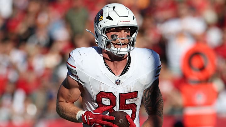 Nov 30, 2025; Tampa, Florida, USA; Arizona Cardinals tight end Trey McBride (85) catches a touchdown during the second half against the Tampa Bay Buccaneers at Raymond James Stadium. Mandatory Credit: Nathan Ray Seebeck-Imagn Images