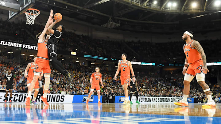Illinois Fighting Illini center Zvonimir Ivisic (44) defends the shot of VCU Rams guard Tyrell Ward (15) Saturday, March 21, 2026, during the NCAA Men’s Basketball Tournament second round game at Bon Secours Wellness Arena in Greenville, South Carolina. Illinois Fighting Illini center Zvonimir Ivisic (44) defends the shot of VCU Rams guard Tyrell Ward (15) Saturday, March 21, 2026, during the NCAA Men’s Basketball Tournament second round game at Bon Secours Wellness Arena in Greenville, South Carolina.