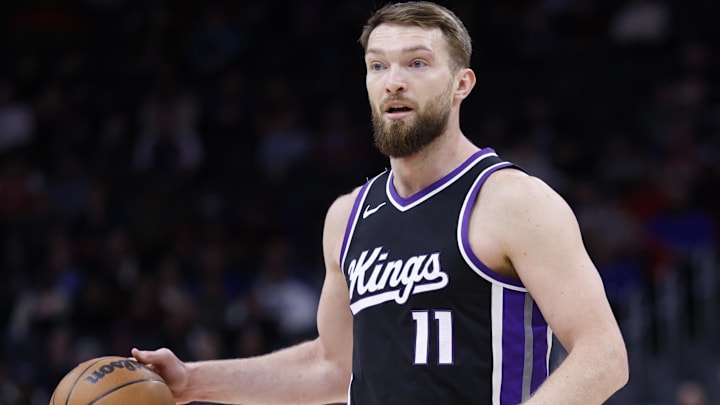 Apr 7, 2025; Detroit, Michigan, USA;  Sacramento Kings forward Domantas Sabonis (11) dribbles in the first half against the Detroit Pistons at Little Caesars Arena.