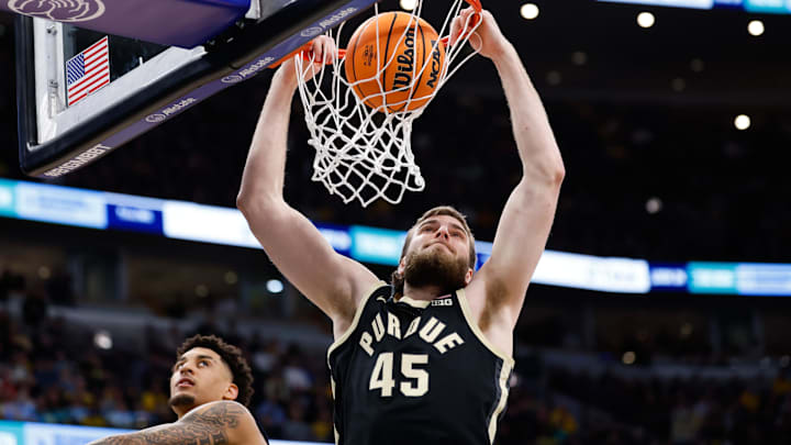 Purdue Boilermakers center Oscar Cluff (45) dunks the ball.