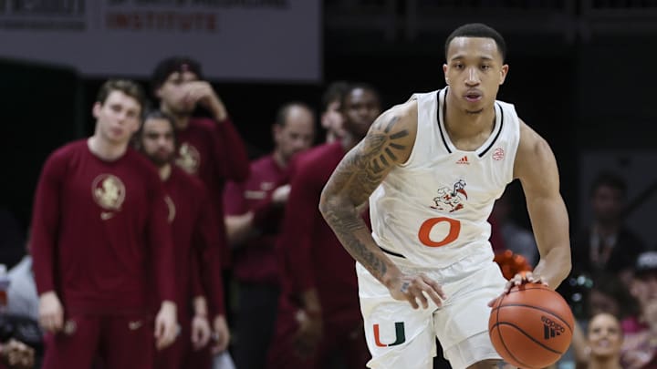 Jan 17, 2024; Coral Gables, Florida, USA; Miami Hurricanes guard Matthew Cleveland (0) dribbles the basketball against the Florida State Seminoles during the second half at Watsco Center. Mandatory Credit: Sam Navarro-Imagn Images