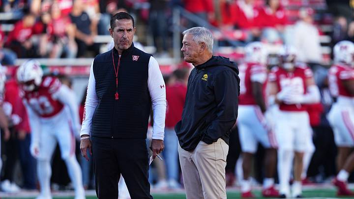 Oct 11, 2025; Madison, Wisconsin, USA; Wisconsin Badgers head coach Luke Fickell and Iowa Hawkeyes head coach Kirk Ferentz meet at mid field before the game at Camp Randall Stadium. Mandatory Credit: Ross Harried-Imagn Images Oct 11, 2025; Madison, Wisconsin, USA; Wisconsin Badgers head coach Luke Fickell and Iowa Hawkeyes head coach Kirk Ferentz meet at mid field before the game at Camp Randall Stadium. Mandatory Credit: Ross Harried-Imagn Images