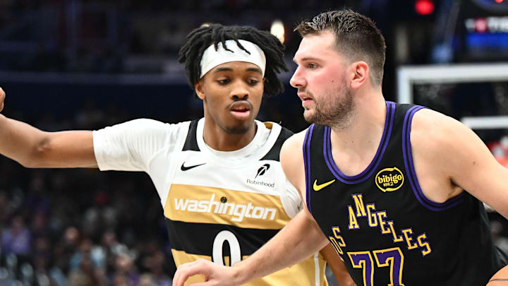 Jan 30, 2026; Washington, District of Columbia, USA; Los Angeles Lakers forward/guard Luka Doncic (77) dribbles as Washington Wizards guard Bilal Coulibaly (0) defends  during the second half at Capital One Arena. Mandatory Credit: Brad Mills-Imagn Images