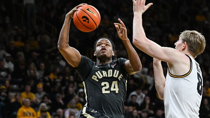 Purdue Boilermakers guard Gicarri Harris (24) goes to the basket as Iowa Hawkeyes forward Cooper Koch (8) defends.