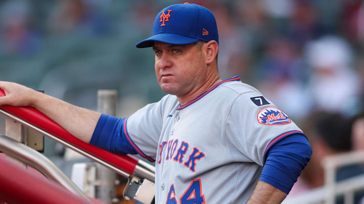 Jun 19, 2025; Atlanta, Georgia, USA; New York Mets manager Carlos Mendoza (64) in the dugout before a game against the Atlanta Braves at Truist Park. Mandatory Credit: Brett Davis-Imagn Images