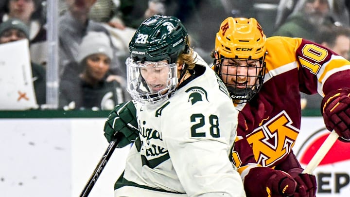 Michigan State's Karsen Dorwart, left, maneuvers around Minnesota's Connor Kurth during the second period on Saturday, Jan. 25, 2025, at Munn Arena in East Lansing.