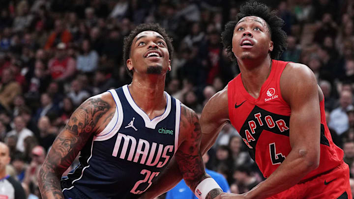Feb 28, 2024; Toronto, Ontario, CAN; Toronto Raptors forward Scottie Barnes (4) and Dallas Mavericks forward P.J. Washington (25) battle for the rebound during the first quarter at Scotiabank Arena. Mandatory Credit: Nick Turchiaro-Imagn Images