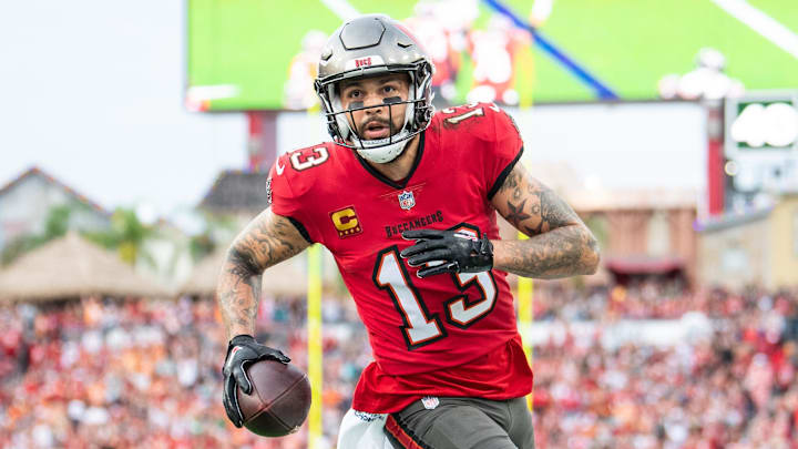 Dec 24, 2023; Tampa, Florida, USA;Tampa Bay Buccaneers wide receiver Mike Evans (13) catches the touchdown against the Jacksonville Jaguars in the second quarter at Raymond James Stadium. Mandatory Credit: Jeremy Reper-Imagn Images Dec 24, 2023; Tampa, Florida, USA;Tampa Bay Buccaneers wide receiver Mike Evans (13) catches the touchdown against the Jacksonville Jaguars in the second quarter at Raymond James Stadium. Mandatory Credit: Jeremy Reper-Imagn Images