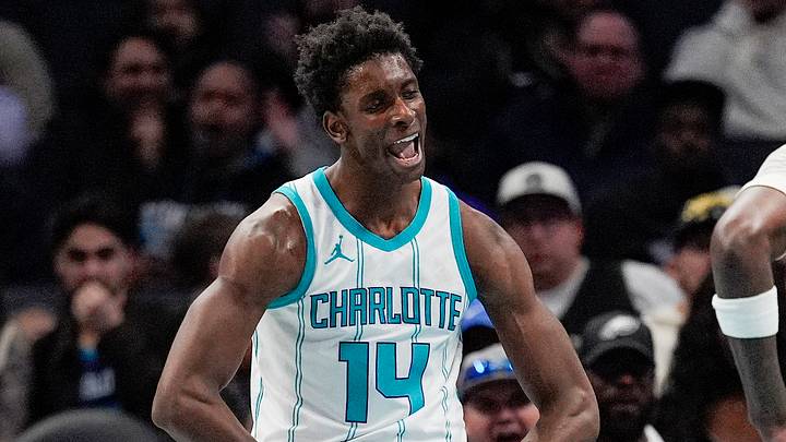 Feb 5, 2025; Charlotte, North Carolina, USA; Charlotte Hornets forward Moussa Diabate (14) reacts to his three point play against the Milwaukee Bucks during the second quarter at Spectrum Center. Mandatory Credit: Jim Dedmon-Imagn Images