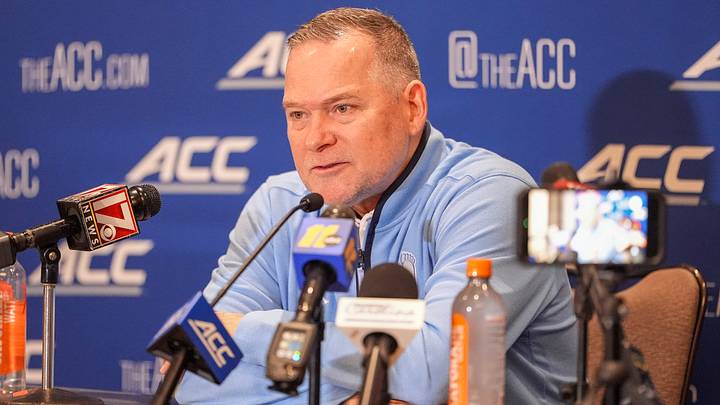Oct 7, 2026; Charlotte, NC, USA; UNC Tar Heels head coach Michael Malone answers questions from the media during the ACC Tip-Off in Charlotte, NC. Mandatory Credit: Jim Dedmon-Imagn Images Oct 7, 2026; Charlotte, NC, USA; UNC Tar Heels head coach Michael Malone answers questions from the media during the ACC Tip-Off in Charlotte, NC. Mandatory Credit: Jim Dedmon-Imagn Images