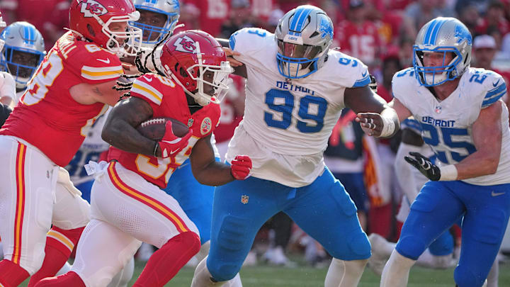 Kansas City Chiefs running back Emani Bailey (39) runs the ball as Detroit Lions defensive tackle Brodric Martin (99) 