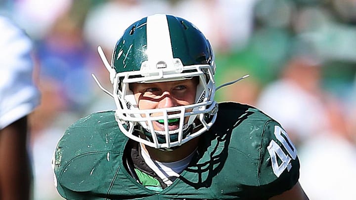 Oct 12, 2013; East Lansing, MI, USA; Michigan State Spartans linebacker Max Bullough (40) looks over Indiana Hoosiers offense during the second half in a game at Spartan Stadium. MSU won 42-28. Mandatory Credit: Mike Carter-Imagn Images