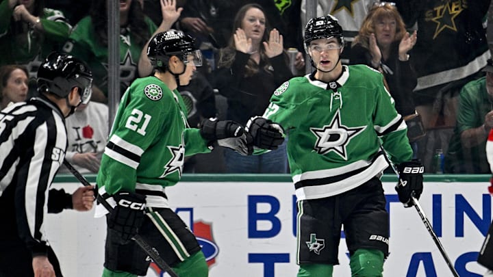 Mar 24, 2026; Dallas, Texas, USA; Dallas Stars left wing Jason Robertson (21) and center Wyatt Johnston (53) celebrates a goal scored by Johnston against the New Jersey Devils during the first period at the American Airlines Center. Mandatory Credit: Jerome Miron-Imagn Images