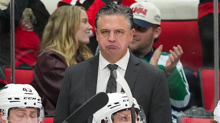 Feb 3, 2026; Raleigh, North Carolina, USA; Ottawa Senators head coach Travis Green looks on from behind the players bench against the Carolina Hurricanes during the third period at Lenovo Center. Mandatory Credit: James Guillory-Imagn Images Feb 3, 2026; Raleigh, North Carolina, USA; Ottawa Senators head coach Travis Green looks on from behind the players bench against the Carolina Hurricanes during the third period at Lenovo Center. Mandatory Credit: James Guillory-Imagn Images