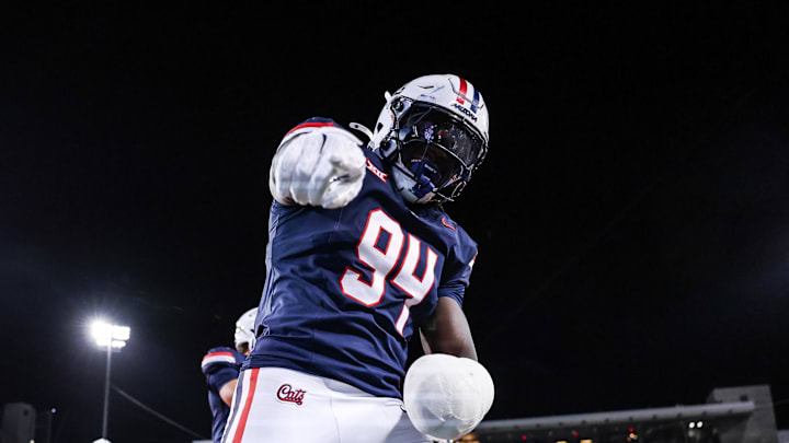 Aug 30, 2025; Tucson, Arizona, USA; Arizona Wildcats defensive lineman Eduwa Okundaye (94) points at the camera after kickoff during the third quarter of the game against the Hawaii Rainbow Warriors at Arizona Stadium. Mandatory Credit: Aryanna Frank-Imagn Images