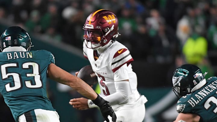 Nov 14, 2024; Philadelphia, Pennsylvania, USA; Washington Commanders quarterback Jayden Daniels (5) is chased boy Philadelphia Eagles linebacker Zack Baun (53) and safety Reed Blankenship (32) during the fourth quarter at Lincoln Financial Field. Mandatory Credit: Eric Hartline-Imagn Images Nov 14, 2024; Philadelphia, Pennsylvania, USA; Washington Commanders quarterback Jayden Daniels (5) is chased boy Philadelphia Eagles linebacker Zack Baun (53) and safety Reed Blankenship (32) during the fourth quarter at Lincoln Financial Field. Mandatory Credit: Eric Hartline-Imagn Images
