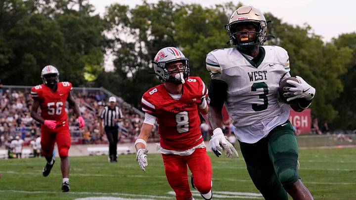 Iowa City West’s Julian Manson (3) runs to the end zone to score during a week 1 Iowa high school football game against City High Aug. 29, 2025 at Iowa City City High in Iowa City, Iowa.