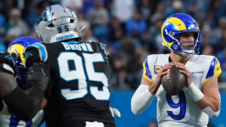 Jan 10, 2026; Charlotte, NC, USA; Los Angeles Rams quarterback Matthew Stafford (9) drops back to pass against the Carolina Panthers in the first half during the NFC Wild Card Round game at Bank of America Stadium. Mandatory Credit: Jim Dedmon-Imagn Images