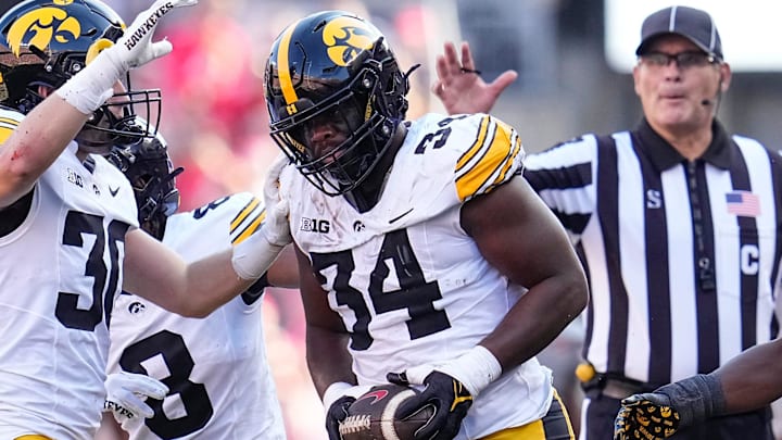 Oct 5, 2024; Columbus, OH, USA; Iowa Hawkeyes linebacker Jay Higgins (34) celebrates a fumble recovery after forcing Ohio State Buckeyes wide receiver Jeremiah Smith to lose the ball during the first half of the NCAA football game at Ohio Stadium.