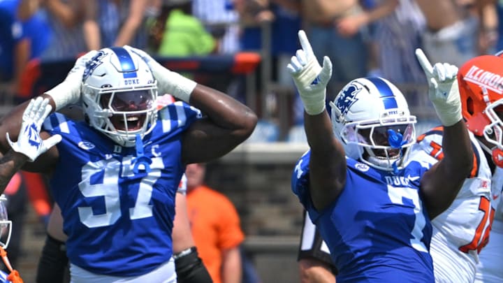 Sep 6, 2025; Durham, North Carolina, USA; Duke Blue Devils cornerback Chandler Rivers (0), linebacker Jaiden Francois (2) and cornerback Kimari Robinson (5) celebrate a tackle by defensive end Vincent Anthony Jr.'s (7) against the Illinois Fighting Illini during the first quarter at Wallace Wade Stadium. Mandatory Credit: Zachary Taft-Imagn Images Sep 6, 2025; Durham, North Carolina, USA; Duke Blue Devils cornerback Chandler Rivers (0), linebacker Jaiden Francois (2) and cornerback Kimari Robinson (5) celebrate a tackle by defensive end Vincent Anthony Jr.'s (7) against the Illinois Fighting Illini during the first quarter at Wallace Wade Stadium. Mandatory Credit: Zachary Taft-Imagn Images