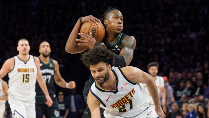 Apr 25, 2026; Minneapolis, Minnesota, USA; Minnesota Timberwolves guard Ayo Dosunmu (13) drives to the lane as Denver Nuggets guard Jamal Murray (27) defends in the second quarter at Target Center. Mandatory Credit: Matt Blewett-Imagn Images