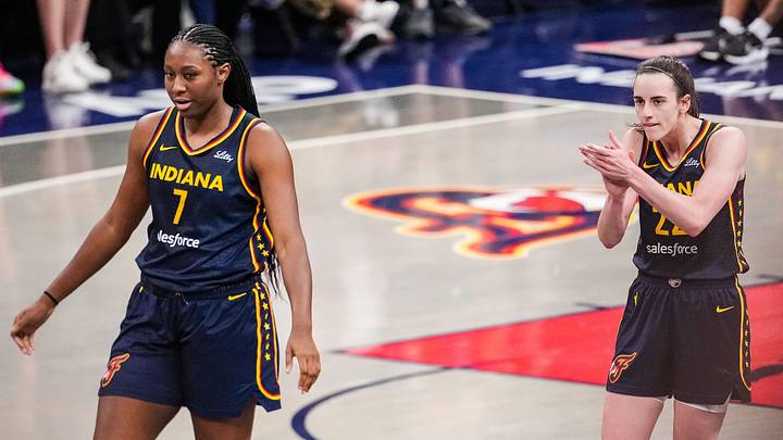 Indiana Fever guard Caitlin Clark (22) claps her hands in excitement with Indiana Fever forward Aliyah Boston (7) Indiana Fever guard Caitlin Clark (22) claps her hands in excitement with Indiana Fever forward Aliyah Boston (7)