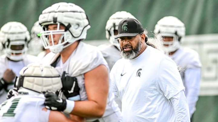 Michigan State's defensive line coach Legi Suiaunoa works with players during the first day of football camp on Tuesday, July 30, 2024, in East Lansing.