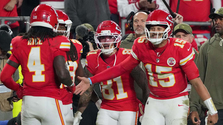 Oct 27, 2025; Kansas City, Missouri, USA; Kansas City Chiefs wide receiver Rashee Rice (4) celebrates after scoring a touchdown against the Washington Commanders with quarterback Patrick Mahomes (15) during the fourth quarter of the game at GEHA Field at Arrowhead Stadium. Mandatory Credit: Denny Medley-Imagn Images