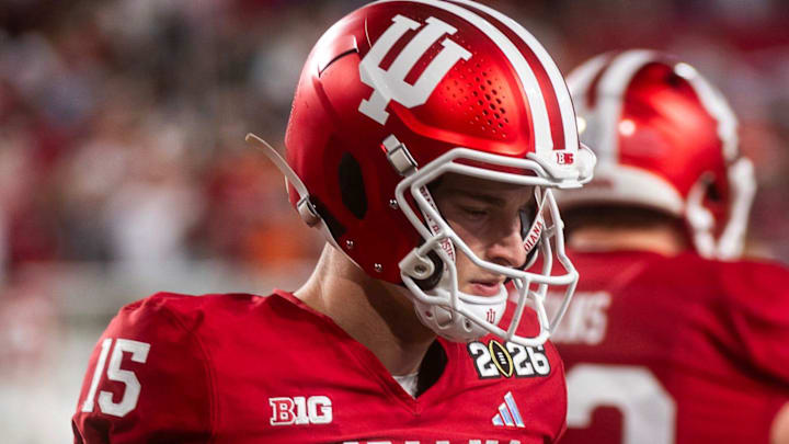Indiana's Fernando Mendoza (15) gets loose before the College Football Playoff National Championship college football game at Hard Rock Stadium in Miami Gardens on Monday, Jan. 19, 2026.