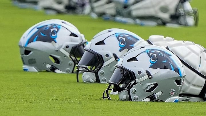 Jul 30, 2024; Charlotte, NC, USA; Carolina Panthers helmets at Carolina Panthers Practice Fields. Mandatory Credit: Jim Dedmon-Imagn Images
