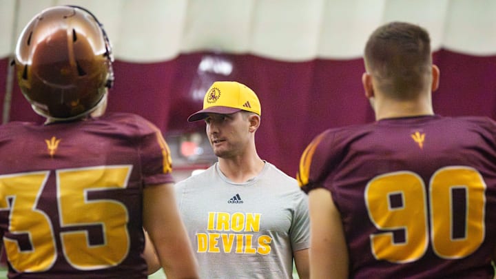 Special Teams Coordinator Jack Nudo works with kickers during practice at the Kajikawa Practice fields on Nov. 11, 2025, in Tempe, Arizona.
