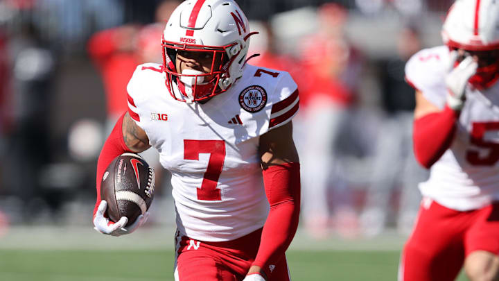 Oct 26, 2024; Columbus, Ohio, USA; Nebraska Cornhuskers defensive back Malcolm Hartzog Jr. (7) returns an interception during the third quarter against the Ohio State Buckeyes at Ohio Stadium. 