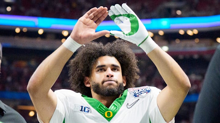 Oregon quarterback Dante Moore walks off the field as the Oregon Ducks face the Indiana Hoosiers in the Peach Bowl on Jan. 9, 2026, at Mercedes-Benz Stadium in Atlanta, Georgia. Oregon quarterback Dante Moore walks off the field as the Oregon Ducks face the Indiana Hoosiers in the Peach Bowl on Jan. 9, 2026, at Mercedes-Benz Stadium in Atlanta, Georgia.