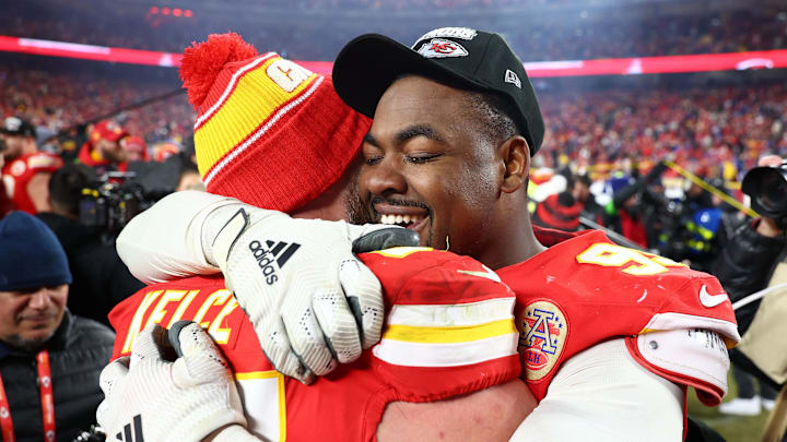Kansas City Chiefs defensive tackle Chris Jones hugs tight end Travis Kelce after the team wins the AFC Championship.