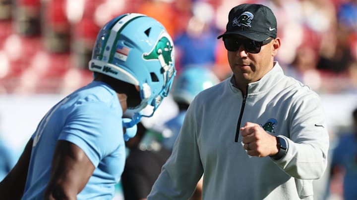 Dec 20, 2024; Tampa, FL, USA; Tulane Green Wave head coach Jon Sumrall against the Florida Gators prior to the game at Raymond James Stadium Dec 20, 2024; Tampa, FL, USA; Tulane Green Wave head coach Jon Sumrall against the Florida Gators prior to the game at Raymond James Stadium