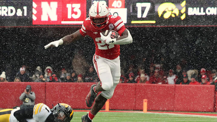 Nebraska running back Emmett Johnson rushes for 12 yards on third-and-1 during the second quarter against Iowa. Nebraska running back Emmett Johnson rushes for 12 yards on third-and-1 during the second quarter against Iowa.