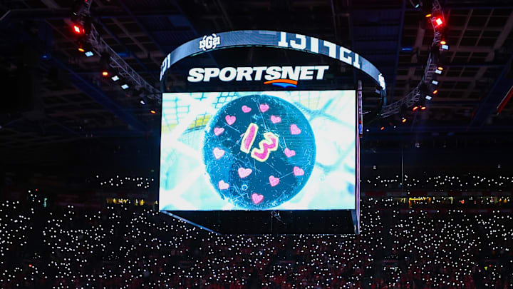Dec 3, 2024; Calgary, Alberta, CAN; Johnny Gaudreau’s family on the ice during ceremonial puck drop by Columbus Blue Jackets center Sean Monahan (23) and Calgary Flames center Mikael Backlund (11) prior to the game between the Calgary Flames and the Columbus Blue Jackets at Scotiabank Saddledome. Mandatory Credit: Sergei Belski-Imagn Images Dec 3, 2024; Calgary, Alberta, CAN; Johnny Gaudreau’s family on the ice during ceremonial puck drop by Columbus Blue Jackets center Sean Monahan (23) and Calgary Flames center Mikael Backlund (11) prior to the game between the Calgary Flames and the Columbus Blue Jackets at Scotiabank Saddledome. Mandatory Credit: Sergei Belski-Imagn Images
