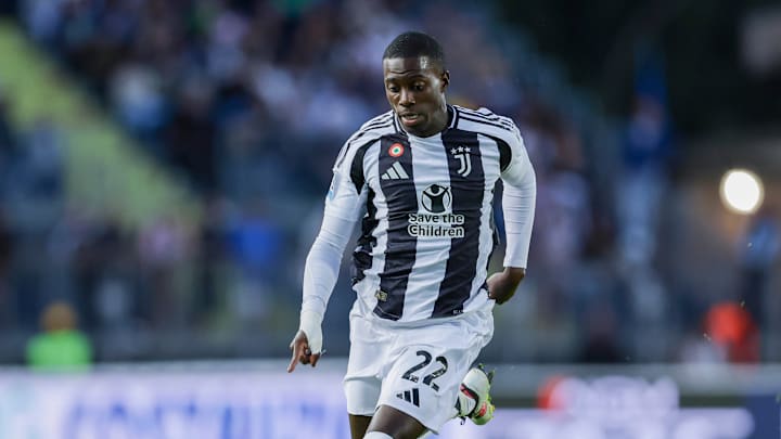 Juventus' American forward Timothy Weah controls the ball...