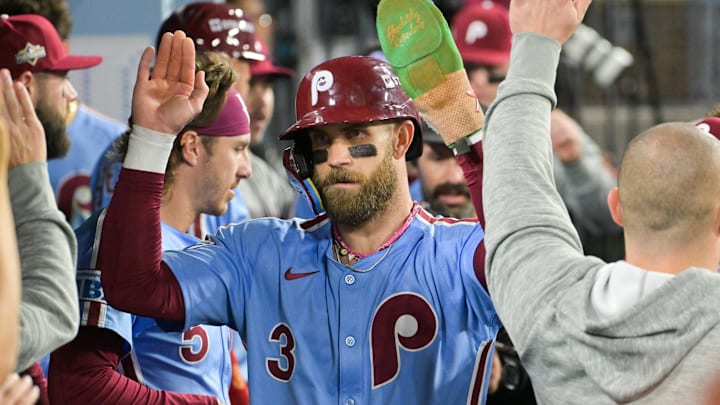Oct 8, 2025; Los Angeles, California, USA; Philadelphia Phillies first baseman Bryce Harper (3) celebrates in the dugout after scoring on a Los Angeles Dodgers throwing error during the fourth inning during game three of the NLDS round for the 2025 MLB playoffs at Dodger Stadium. Mandatory Credit: Jayne Kamin-Oncea-Imagn Images Oct 8, 2025; Los Angeles, California, USA; Philadelphia Phillies first baseman Bryce Harper (3) celebrates in the dugout after scoring on a Los Angeles Dodgers throwing error during the fourth inning during game three of the NLDS round for the 2025 MLB playoffs at Dodger Stadium. Mandatory Credit: Jayne Kamin-Oncea-Imagn Images