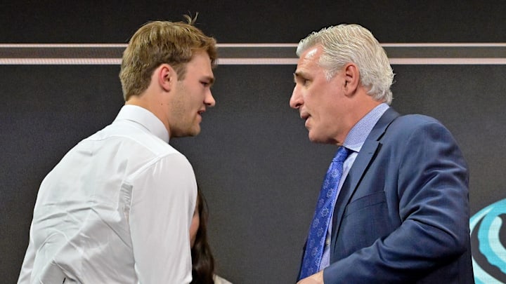 Jul 7, 2022; Montreal, Quebec, CANADA; Shane Wright shakes hands with Seattle Kraken general manager Ron Francis after being selected as the number four overall pick to the Seattle Kraken in the first round of the 2022 NHL Draft at Bell Centre. Mandatory Credit: Eric Bolte-Imagn Images