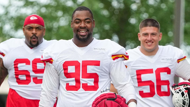 Jul 22, 2025; St. Joseph, MO, USA; Kansas City Chiefs defensive tackles Mike Pennel Jr. (69) and Chris Jones (95) and defensive end George Karlaftis (56) walk down the hill to the practice fields during training camp at Missouri Western State University. Mandatory Credit: Denny Medley-Imagn Images