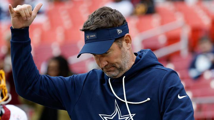 Dallas Cowboys head coach Brian Schottenheimer looks on during warmups before the game against the Washington Commanders. Dallas Cowboys head coach Brian Schottenheimer looks on during warmups before the game against the Washington Commanders.