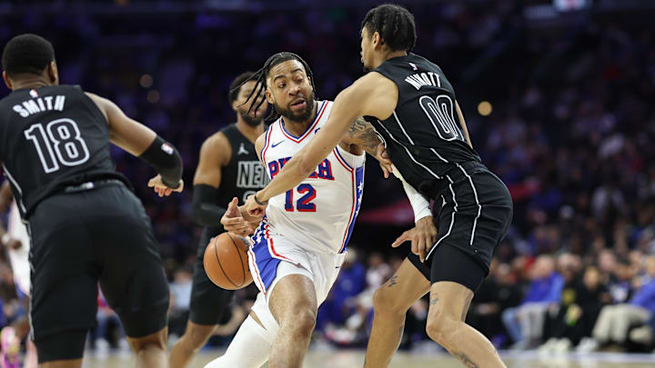 Mar 14, 2026; Philadelphia, Pennsylvania, USA; Philadelphia 76ers forward Trendon Watford (12) drives against Brooklyn Nets forward Josh Minott (00) during the third quarter at Xfinity Mobile Arena. Mandatory Credit: Bill Streicher-Imagn Images Mar 14, 2026; Philadelphia, Pennsylvania, USA; Philadelphia 76ers forward Trendon Watford (12) drives against Brooklyn Nets forward Josh Minott (00) during the third quarter at Xfinity Mobile Arena. Mandatory Credit: Bill Streicher-Imagn Images