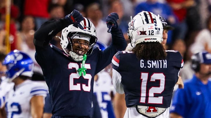Oct 11, 2025; Tucson, Arizona, USA; Arizona Wildcats defensive backs Michael Dansby (25) and Genesis Smith (12) both celebrate during the fourth quarter of the game against the Brigham Young Cougars at Arizona Stadium. Mandatory Credit: Aryanna Frank-Imagn Images