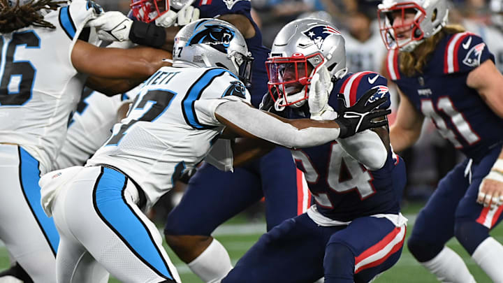 Aug 19, 2022; Foxborough, Massachusetts, USA; New England Patriots safety Joshuah Bledsoe (24) blocks Carolina Panthers running back John Lovett (37) during the second half of a preseason game at Gillette Stadium. Mandatory Credit: Eric Canha-Imagn Images