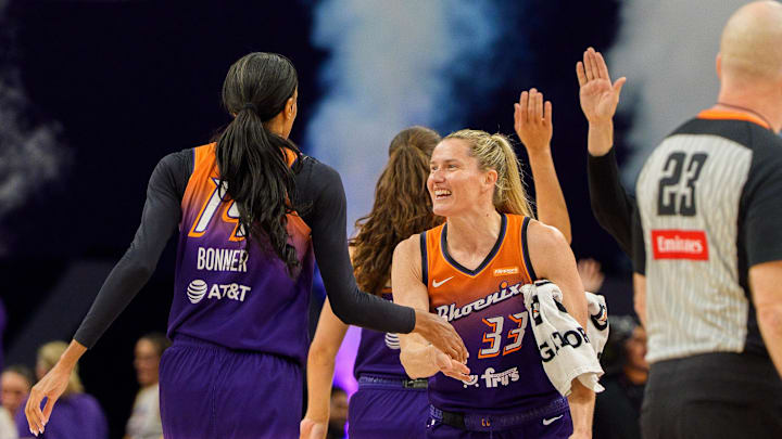 Aug 30, 2025; Phoenix, Arizona, USA; Phoenix Mercury guard Sami Whitcomb (33) and guard-forward DeWanna Bonner (14) celebrate as the Phoenix Mercury pull ahead during the second half against the New York Liberty at Footprint Center. Mandatory Credit: Allan Henry-Imagn Images