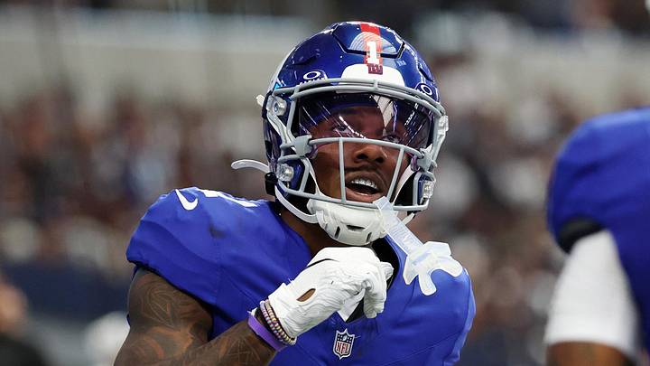 Sep 14, 2025; Arlington, Texas, USA; New York Giants wide receiver Malik Nabers (1) celebrates after scoring a touchdown against the Dallas Cowboys during the second quarter at AT&T Stadium.  