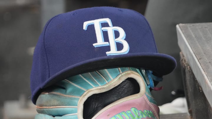 Sep 26, 2025; Toronto, Ontario, CAN; The hat and glove of Tampa Bay Rays third baseman Junior Caminero (13) in the dugout during the game against the Toronto Blue Jays at Rogers Centre. 