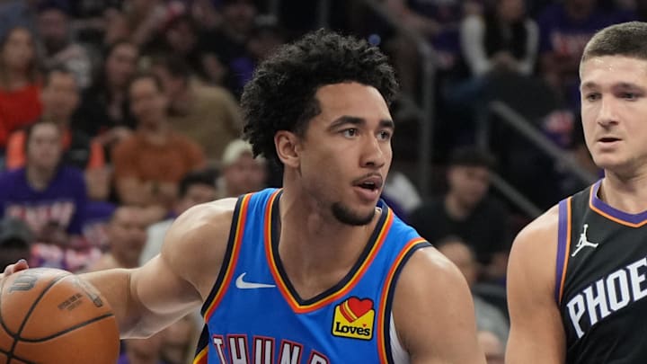 Apr 25, 2026; Phoenix, Arizona, USA; Oklahoma City Thunder guard Jared McCain (3) drives around Phoenix Suns guard Grayson Allen (8) in the first half during game three of the first round of the 2026 NBA Playoffs at Mortgage Matchup Center. Mandatory Credit: Rick Scuteri-Imagn Images