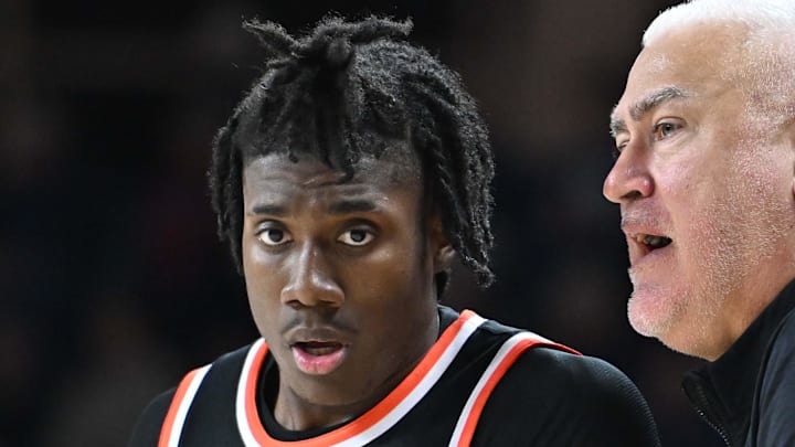 Jan 28, 2025; Spokane, Washington, USA; Oregon State Beavers head coach Wayne Tinkle, right talks with Oregon State Beavers forward Maxim Logue (77) during a game against the Gonzaga Bulldogs in the second half at McCarthey Athletic Center. Mandatory Credit: James Snook-Imagn Images